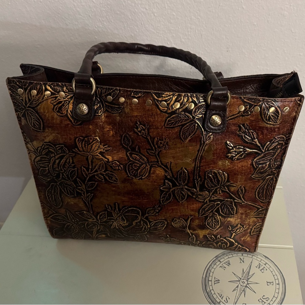 Patricia Nash leather with brown and gold leaf designs. Quality designer tote